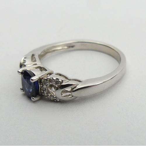 90A - 18ct white gold sapphire and diamond ring, 3 grams. Size K 1/2, 5.4 mm wide. UK Postage £12.