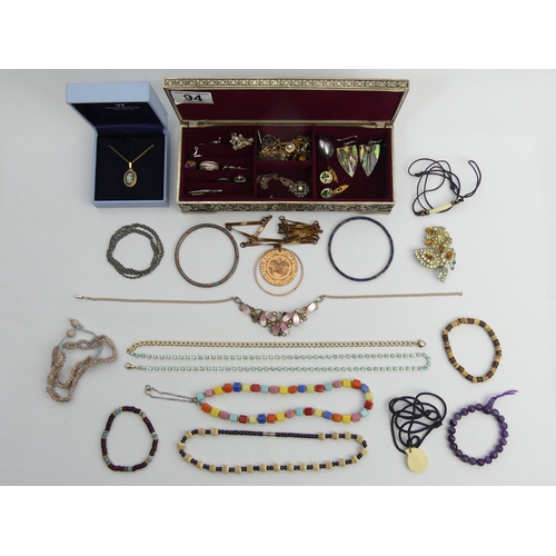 94 - A box of costume and silver jewellery including a boxed Wedgwood pendant and chain. UK Postage £12.