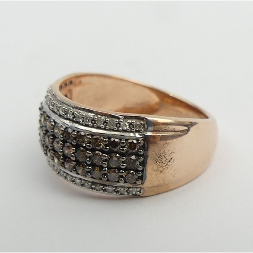 97 - 9ct rose gold white and chocolate diamond ring, 4.2 grams. Size N, 9.4 mm wide. UK Postage £12.