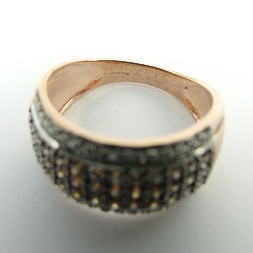 97 - 9ct rose gold white and chocolate diamond ring, 4.2 grams. Size N, 9.4 mm wide. UK Postage £12.