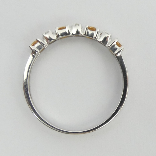 99 - 9ct white gold yellow topaz and diamond ring, 1.4 grams. Size N, 2.9 mm wide. UK Postage £12.