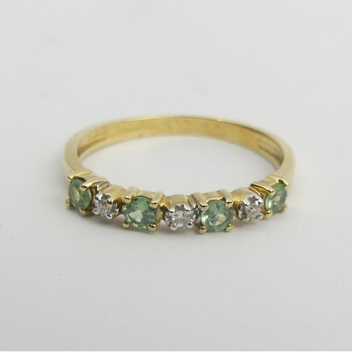 100 - 9ct white gold peridot and diamond ring, 1.4 grams. Size M 1/2, 2.8 mm wide. UK Postage £12.