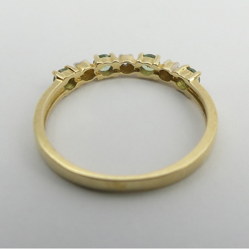 100 - 9ct white gold peridot and diamond ring, 1.4 grams. Size M 1/2, 2.8 mm wide. UK Postage £12.