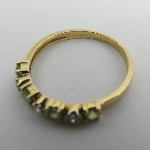 100 - 9ct white gold peridot and diamond ring, 1.4 grams. Size M 1/2, 2.8 mm wide. UK Postage £12.