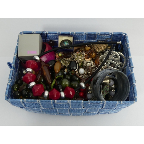 119 - A basket of costume jewellery including bead necklaces. UK Postage £12.