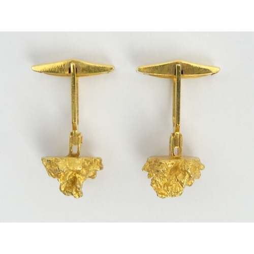 120 - A pair of 10ct gold nugget design torpedo back cufflinks. 10.9 grams, 13.5 mm in diameter. UK Postag... 