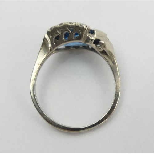 117 - 10ct white gold (ignore 18ct mark) blue and white paste set ring, 4.1 grams. Size T, 10.9 mm wide. U... 