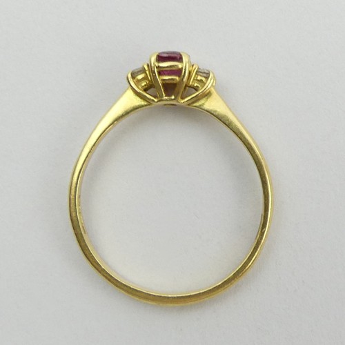 116 - 18ct gold ruby and diamond three stone ring, 3 grams. Size S 1/2, 5.6 mm. UK Postage £12.