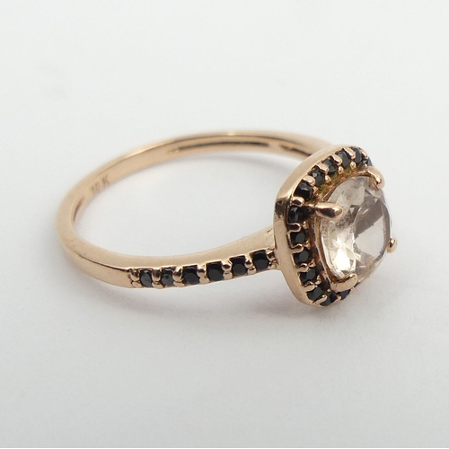 128 - 10ct rose gold pale pink tourmaline and black quartz ring, 1.6 grams. Size J 1/2, 8.5 mm wide. UK Po... 