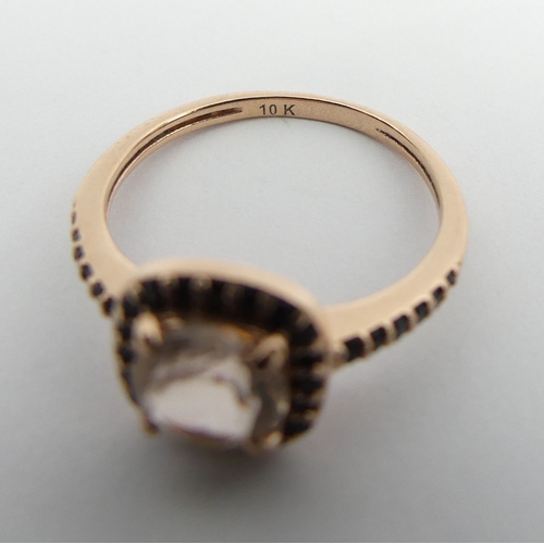 128 - 10ct rose gold pale pink tourmaline and black quartz ring, 1.6 grams. Size J 1/2, 8.5 mm wide. UK Po... 