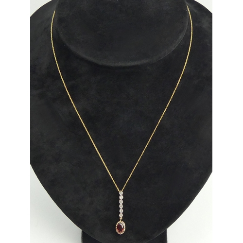 130 - 9ct gold rhodalite and diamond pendant and chain, 1.7 grams. Chain 44 cm, pendant 30 mm long. UK Pos... 