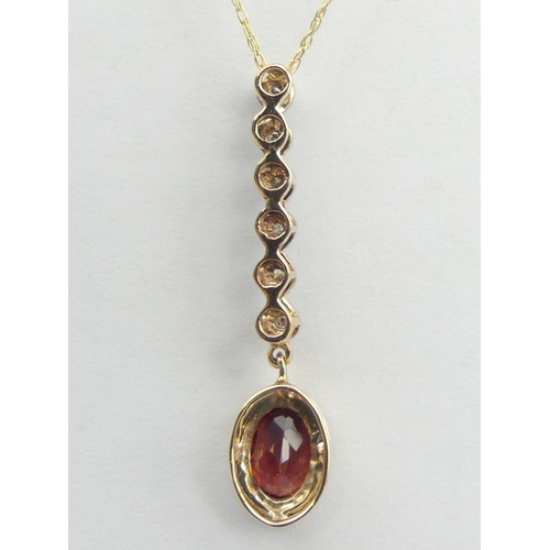 130 - 9ct gold rhodalite and diamond pendant and chain, 1.7 grams. Chain 44 cm, pendant 30 mm long. UK Pos... 