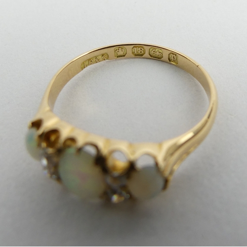 131 - Victorian 18ct gold opal and diamond ring, Birm.1889, 2.9 grams. Size N, 6.8 mm. UK Postage £12.