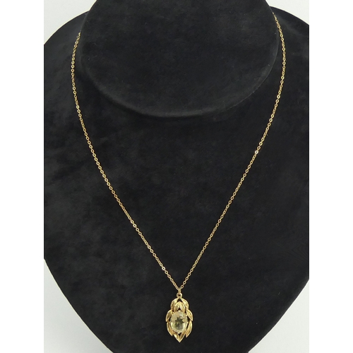 141 - 9ct gold smokey quartz pendant and chain, 3.2 grams. Chain 42 cm, pendant 2.5 cm. UK Postage £12.