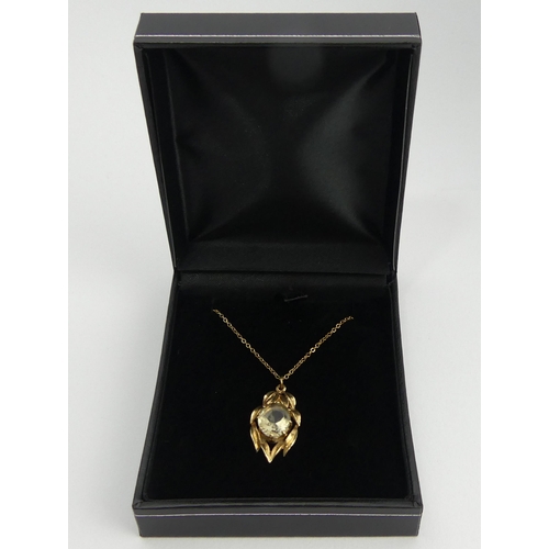 141 - 9ct gold smokey quartz pendant and chain, 3.2 grams. Chain 42 cm, pendant 2.5 cm. UK Postage £12.