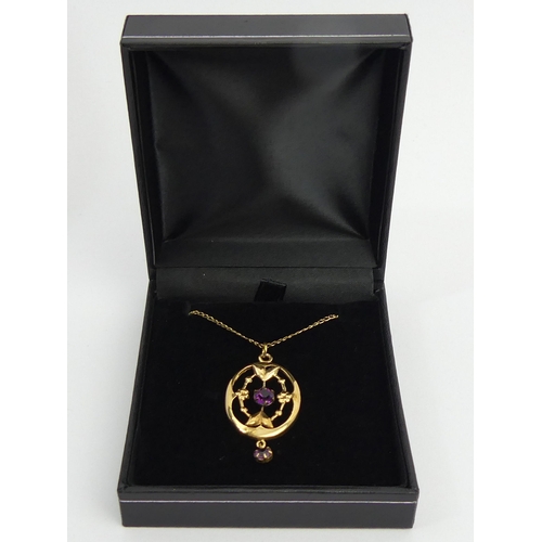 142 - 9ct gold paste set pendant and chain, 2.8 grams. Chain 46 cm, pendant 38 mm. UK Postage £12.