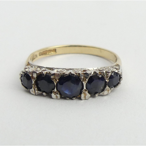 148 - 9ct gold sapphire five stone ring, 2.7 grams. Size O, 5.2 mm. UK Postage £12.