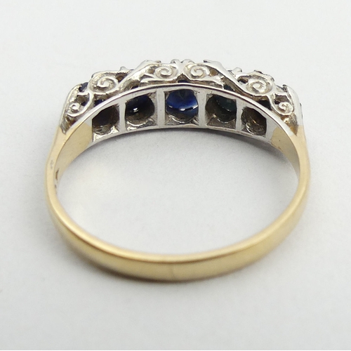 148 - 9ct gold sapphire five stone ring, 2.7 grams. Size O, 5.2 mm. UK Postage £12.