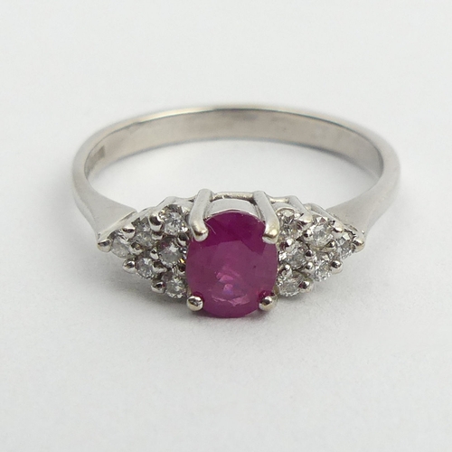 149 - 18ct white gold ruby and diamond ring, 3.5 grams. Size Q 1/2, 6 mm wide. UK Postage £12.