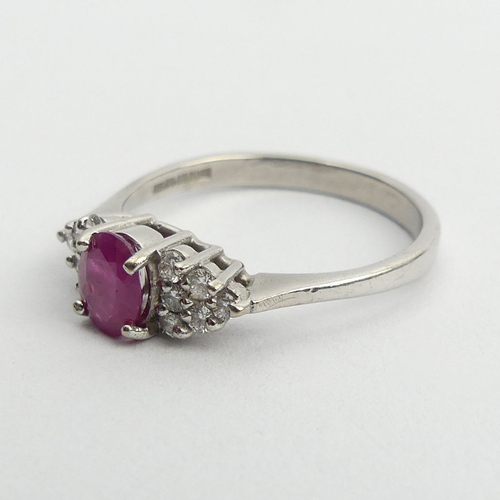 149 - 18ct white gold ruby and diamond ring, 3.5 grams. Size Q 1/2, 6 mm wide. UK Postage £12.