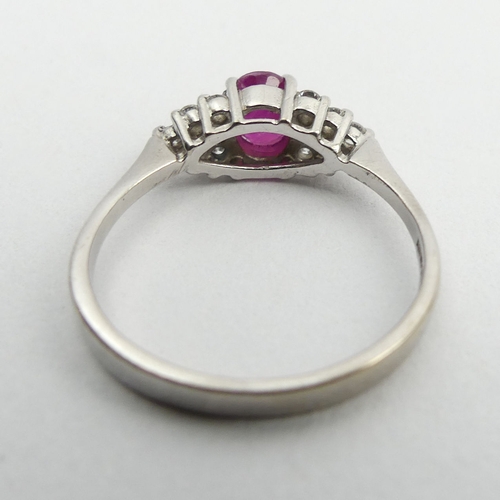 149 - 18ct white gold ruby and diamond ring, 3.5 grams. Size Q 1/2, 6 mm wide. UK Postage £12.