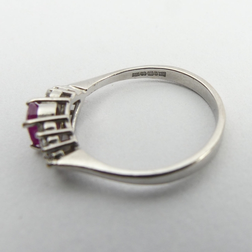 149 - 18ct white gold ruby and diamond ring, 3.5 grams. Size Q 1/2, 6 mm wide. UK Postage £12.