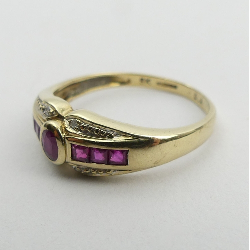 150A - 9ct gold seven stone ruby and diamond ring, 3.1 grams. Size U, 7.8 mm wide. UK Postage £12.