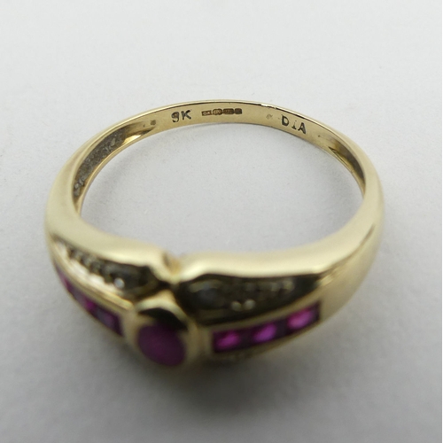 150A - 9ct gold seven stone ruby and diamond ring, 3.1 grams. Size U, 7.8 mm wide. UK Postage £12.