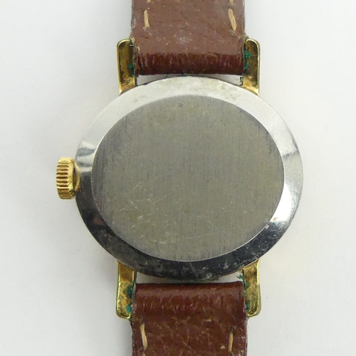 158 - Ladies Omega gold tone manual wind watch on a leather strap. 25 mm wide. UK Postage £12.
Condition r... 