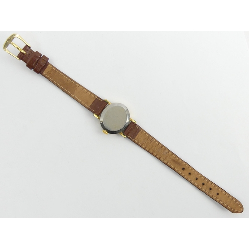 158 - Ladies Omega gold tone manual wind watch on a leather strap. 25 mm wide. UK Postage £12.
Condition r... 