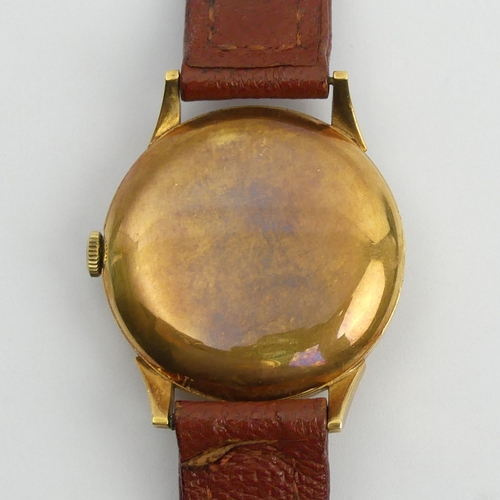 168 - Garrard 18ct gold automatic movement watch. 35 mm wide.  UK Postage £12.
Condition report: In workin... 