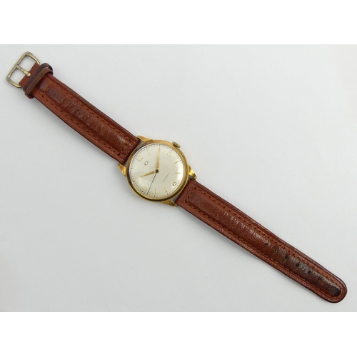 168 - Garrard 18ct gold automatic movement watch. 35 mm wide.  UK Postage £12.
Condition report: In workin... 