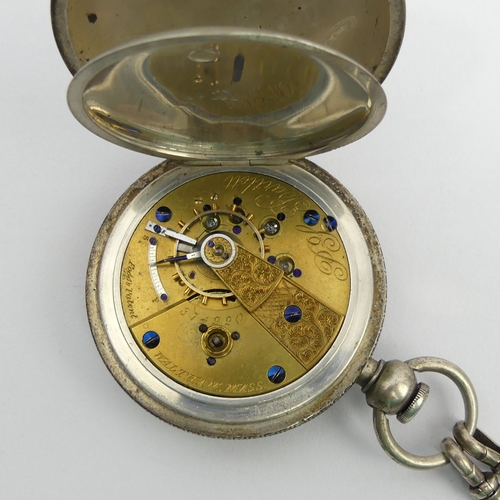 170C - An American watch company full hunter key wind pocket watch on a double clip silver Albert chain. Wa... 