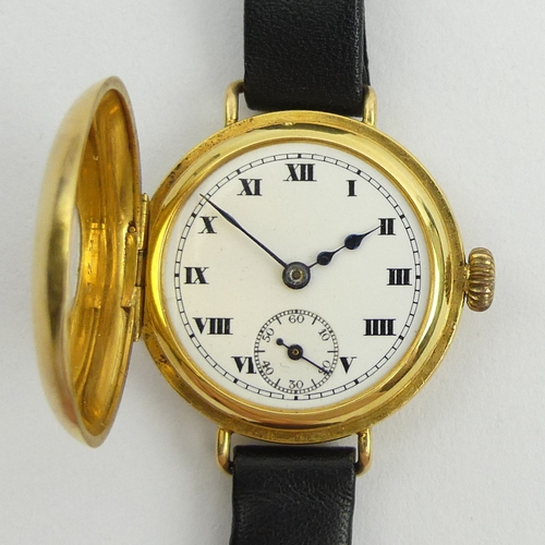 172 - 18ct gold half hunter wristwatch, 24.9 grams gross. 30 mm wide. UK Postage £12. 
Condition report: N... 