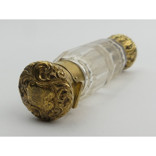 205B - Victorian double ended gilt metal and glass perfume bottle. 9.5 cm. UK Postage £12.