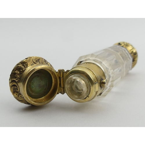 205B - Victorian double ended gilt metal and glass perfume bottle. 9.5 cm. UK Postage £12.