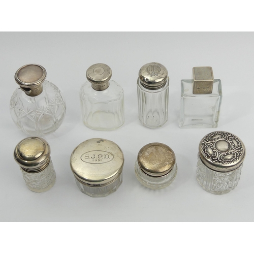 226 - Eight Victorian and later silver and glass dressing table bottles. Largest 10 cm.  UK Postage £15.