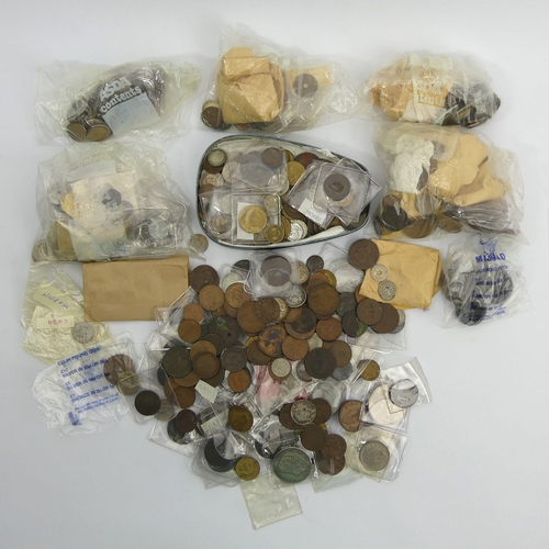 238 - A box of mixed coinage including a Georgian cartwheel penny, foreign and silver content coins.