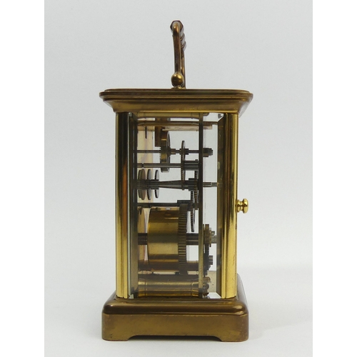 251 - A Mathew Norman brass cased carriage clock. 15 cm high. UK Postage £12.