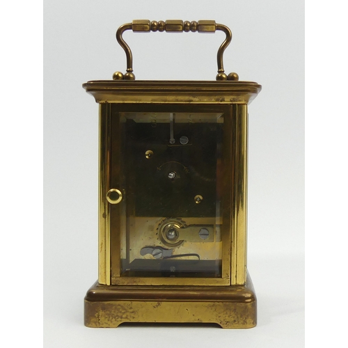 251 - A Mathew Norman brass cased carriage clock. 15 cm high. UK Postage £12.