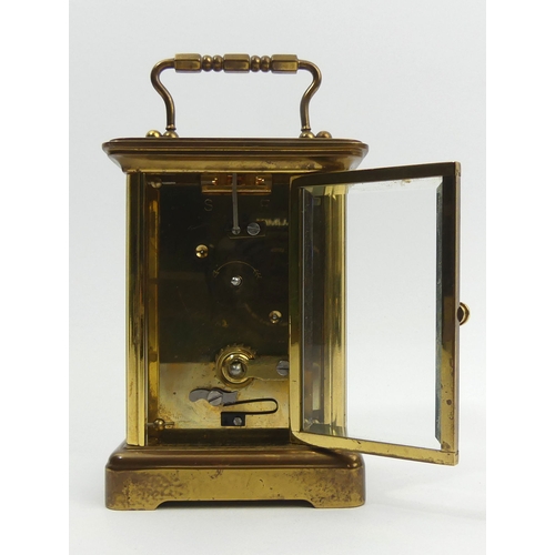 251 - A Mathew Norman brass cased carriage clock. 15 cm high. UK Postage £12.