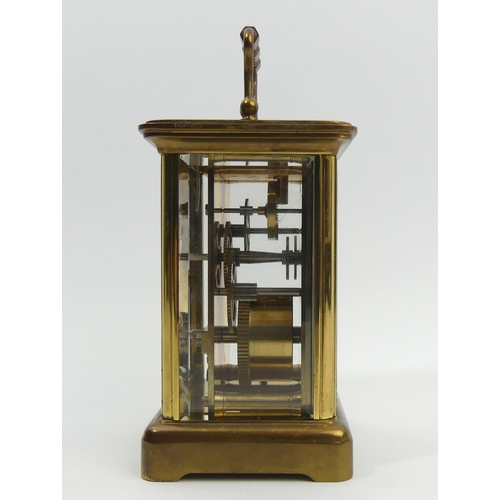 251 - A Mathew Norman brass cased carriage clock. 15 cm high. UK Postage £12.