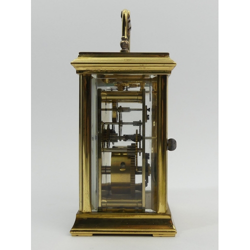 252 - A St. James brass cased carriage clock. 15 cm high. UK Postage £12.