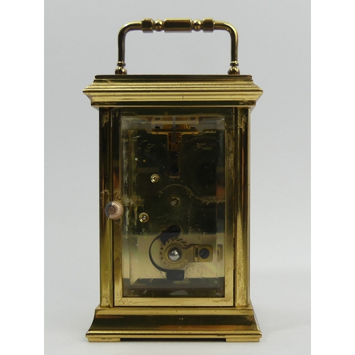 252 - A St. James brass cased carriage clock. 15 cm high. UK Postage £12.