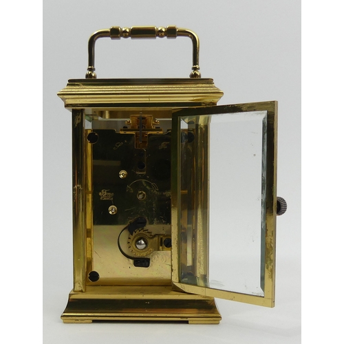 252 - A St. James brass cased carriage clock. 15 cm high. UK Postage £12.