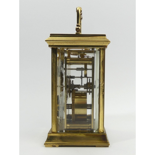 252 - A St. James brass cased carriage clock. 15 cm high. UK Postage £12.