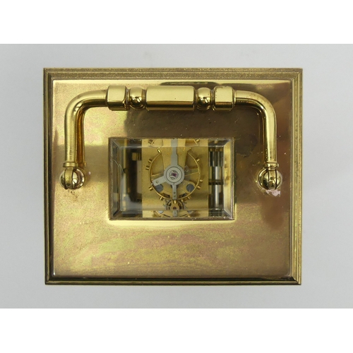 252 - A St. James brass cased carriage clock. 15 cm high. UK Postage £12.