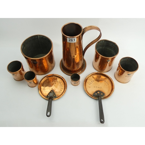 261 - A 19th century set of copper measures, two copper sauce pan lids and a single handled 25.5 cm jug 