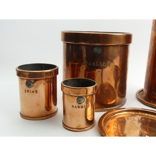 261 - A 19th century set of copper measures, two copper sauce pan lids and a single handled 25.5 cm jug 