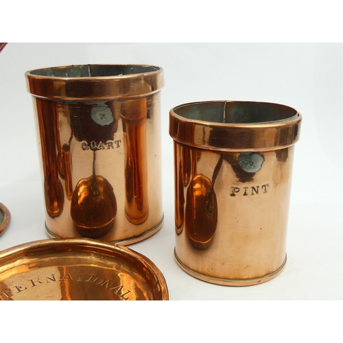 261 - A 19th century set of copper measures, two copper sauce pan lids and a single handled 25.5 cm jug 